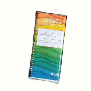 rainbow coloured wrapping with white rectangle that has simply peaceful,  English and French
