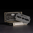 Black background with black box with white print & blade beside