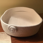 natural coloured tray made out of rope  sitting on table