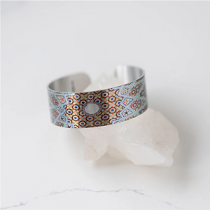 blue and copper colours on silver bracelet, ovals and straight lines
