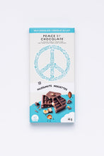 Load image into Gallery viewer, chocolate bar in a light blue &amp; white wrapper with a peace symbol on it
