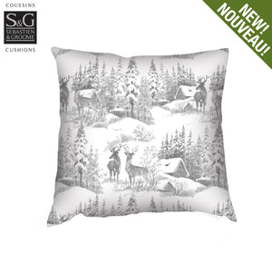 decorative throw cushion with a winter wilderness theme -white and grey colours, trees,deer,cottage