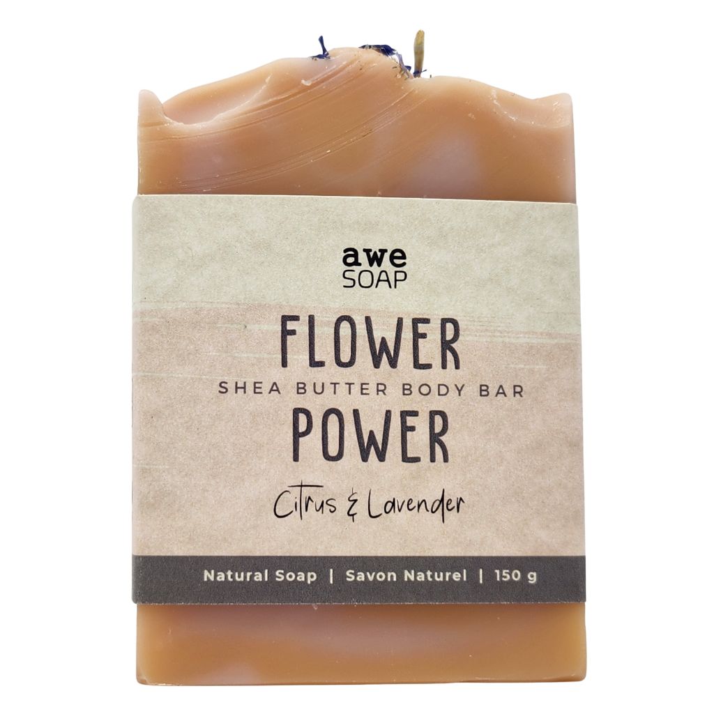 close up of handmade bar of soap with paper sleeve