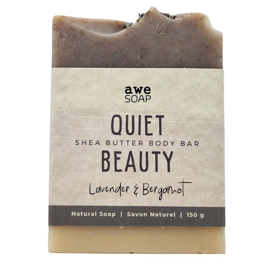 close up of handmade bar of soap with paper sleeve