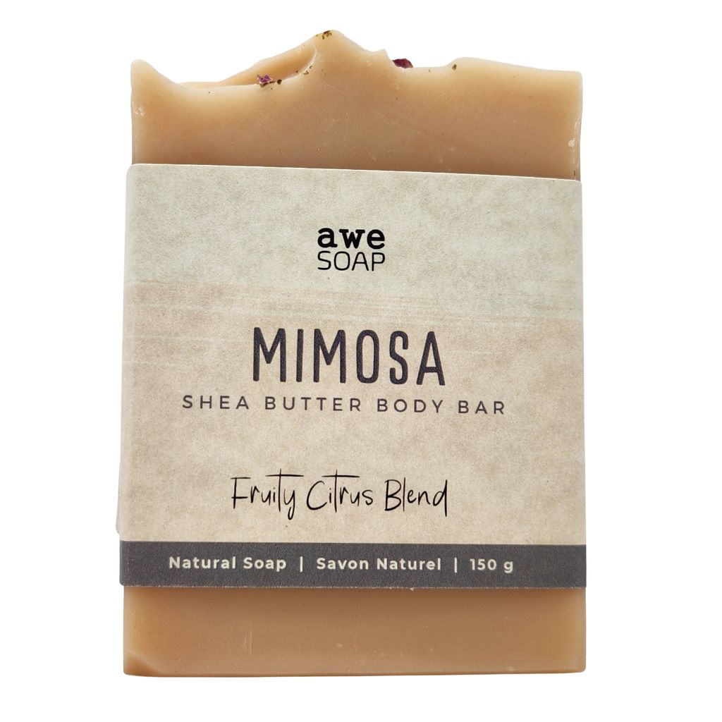 close up of handmade bar of soap with paper sleeve