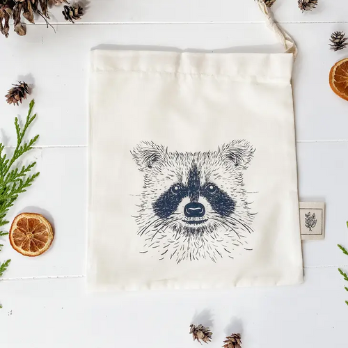 drawstring bag with the face of a very cute raccoon, printed in black ink