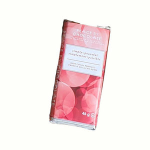 pink & red circles wrapping with white rectangle that has simply peaceful on it in English & French