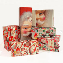 Load image into Gallery viewer, Creepy Santa Coming To Town Wrapping Paper wrapped around different presents
