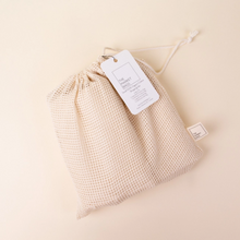 Load image into Gallery viewer, A mesh bag with white tag, the bag has a drawstring
