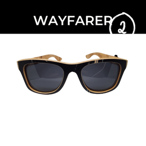 front view of wooden sunglasses on white background , black boarder at top of picture