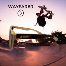 Load image into Gallery viewer, side view of wooden sunglasses with a skateboard park and a skateboarder catching air
