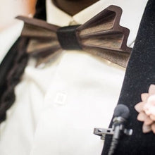 Load image into Gallery viewer, person wearing a dark brown bow tie - he is in a suite with microphone attached to lapel
