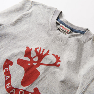 light grey t shirt with red caribou head and the word Canada written underneath