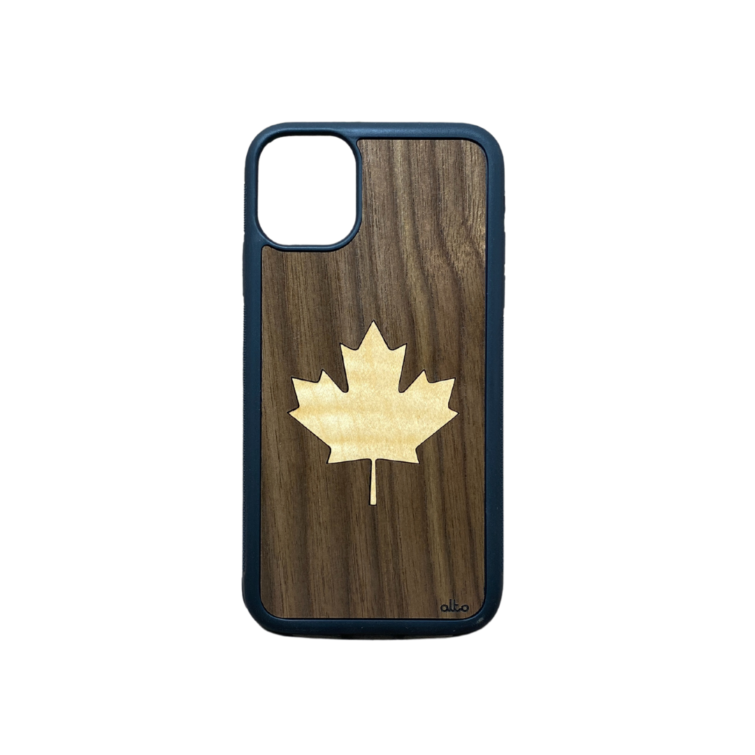 light coloured maple leaf inlaid in darker wood
