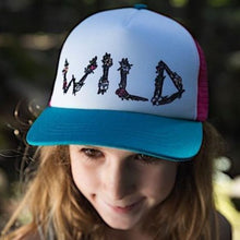 Load image into Gallery viewer, child wearing a hat/the word wild written with sticks/white front panel/pink back panel/teal brim
