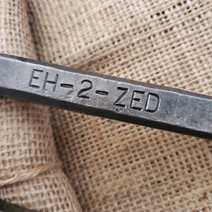 Railway spike bottle opener with Eh-2-Zed stamped into it