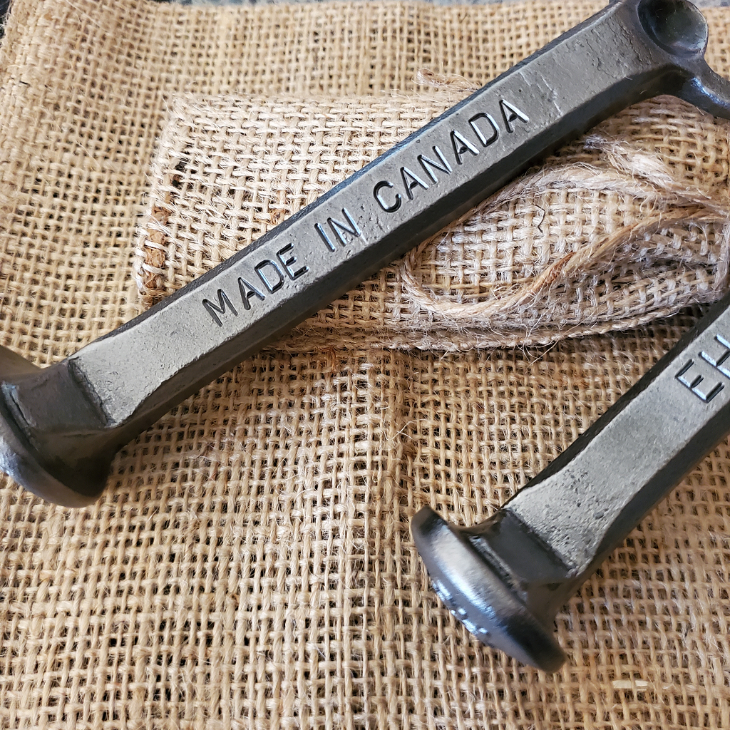 Bottle opener made from railway spike that has stamped in the side Made in Canada