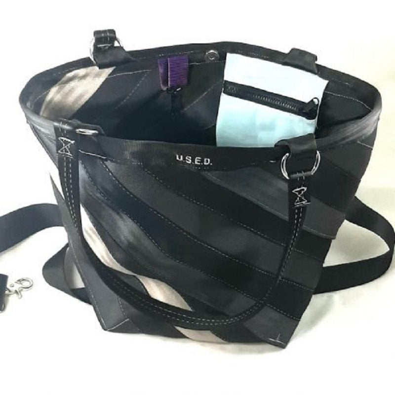 trapezoid shape with the belts sewn together on a diagonal, blues, black a beige belt being used