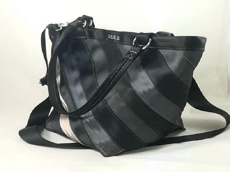 trapezoid shape with the belts sewn together on a diagonal, blues, black a beige belt being used
